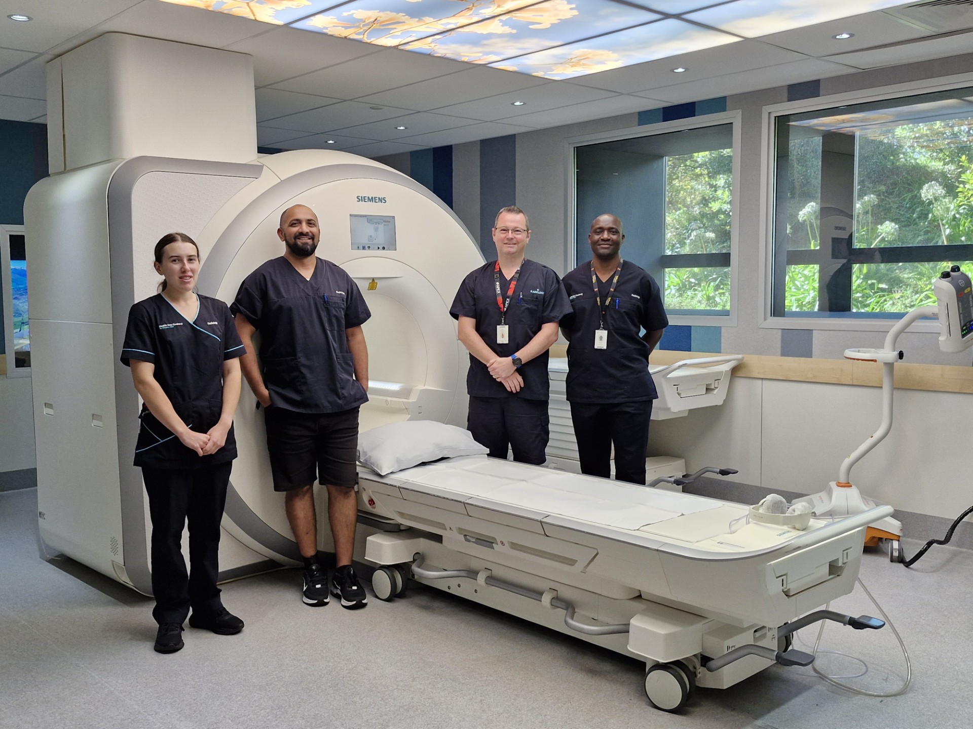 The team behind the waitlist turnaround – Wellington Hospital MRI technologists took a short break from scanning to get their photo taken.